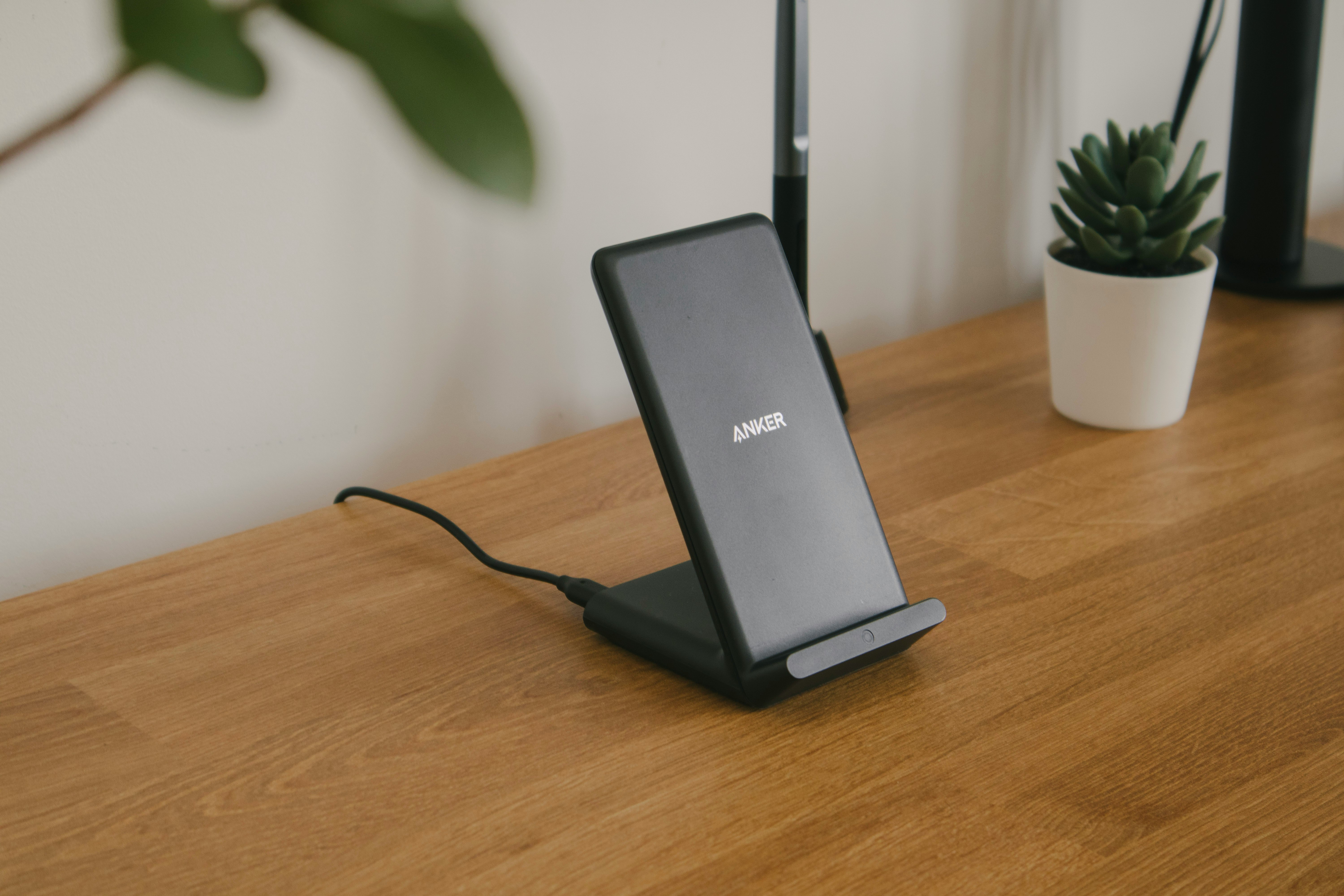 black and gray rectangular device on brown wooden table